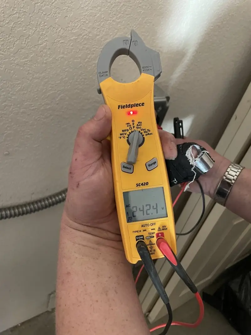 Voltage testing with clamp meter during Electrical Installation Services in Mooresville